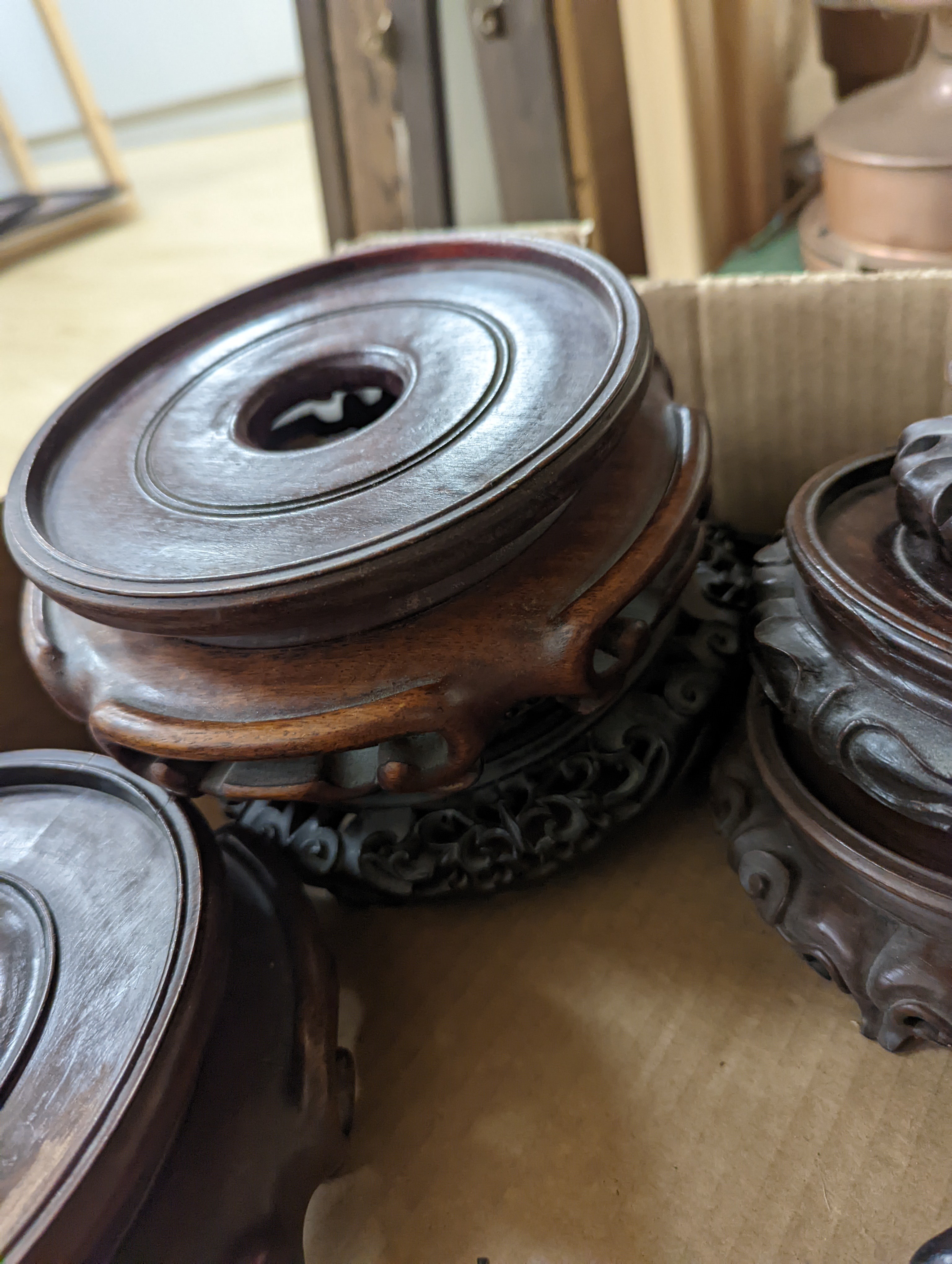 A collection of Chinese stands and bases, 1 box